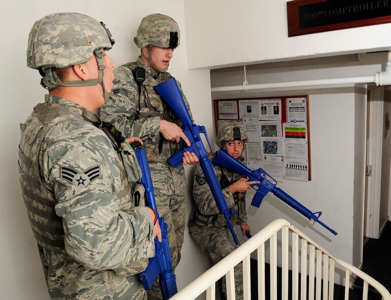 RAF MILDENHALL, England – Airmen from the 100th Security Forces Squadron clear out the 100th Comptroller Squadron Finance Office after reports that an assailant with a gun had entered the building during an active shooter exercise held at RAF Mildenhall June 20, 2012. Security forces first responders were evaluated during the exercise on their ability to respond, access the situation and neutralize the threat. (U.S. Air Force photo/ Senior Airman Ethan Morgan)