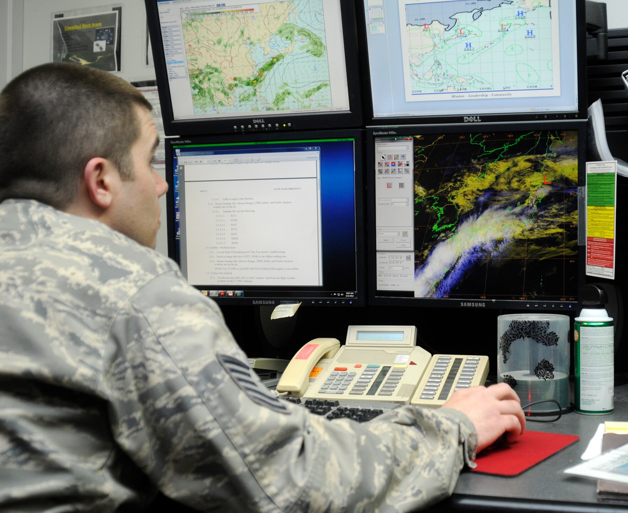 U.S. Air Force Tech Sgt. Steve Fanis, 35th Operations Support Squadron weather flight forecaster, looks at a monitor that shows precipitation and cloud locations at Misawa Air Base, Japan, June 21, 2012. Ensuring pilot safety is one of the top priorities for weather forecasters in order to complete the mission. (U.S. Air Force photo by Airman 1st Class Zachary Kee/Released)