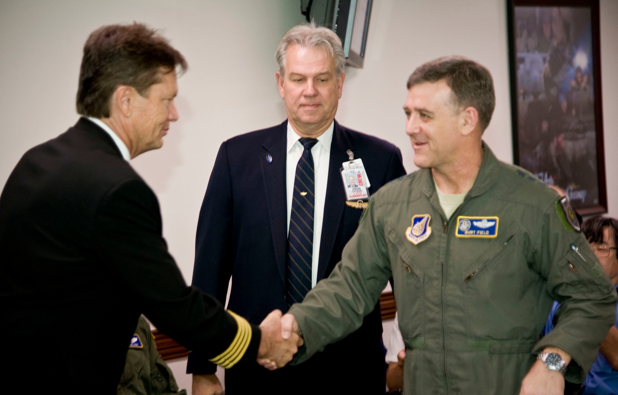 YOKOTA AIR BASE, Japan - Lt. Gen. Burton M. Field, U.S. Forces, Japan, and 5th Air Force commander, meets with Pierre Frenay, a chief pilot with United Airlines, Guam, during a ceremony at Yokota Air Base, Japan on June 21, 2012. Pilots from United and Continental Airlines visited the base to thank the troops for their work during Operation Tomadachi on March 11, 2011. (U.S. Air Force Photo by Staff Sgt. Shawn Rhodes)