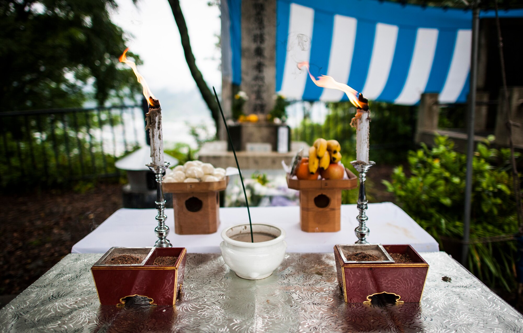SHIZUOKA, Japan -- Traditional Buddhist offerings to the deceased stand on a table during a B-29 memorial ceremony on Mount Shizuhata, Shizuoka, Japan, June 16, 2012. Americans and Japanese ceremony attendees honored those who died in Shizuoka on June 19, 1945, during a B-29 bombing raid and aircraft crash. (U.S. Air Force photo by Tech. Sgt. Samuel Morse)