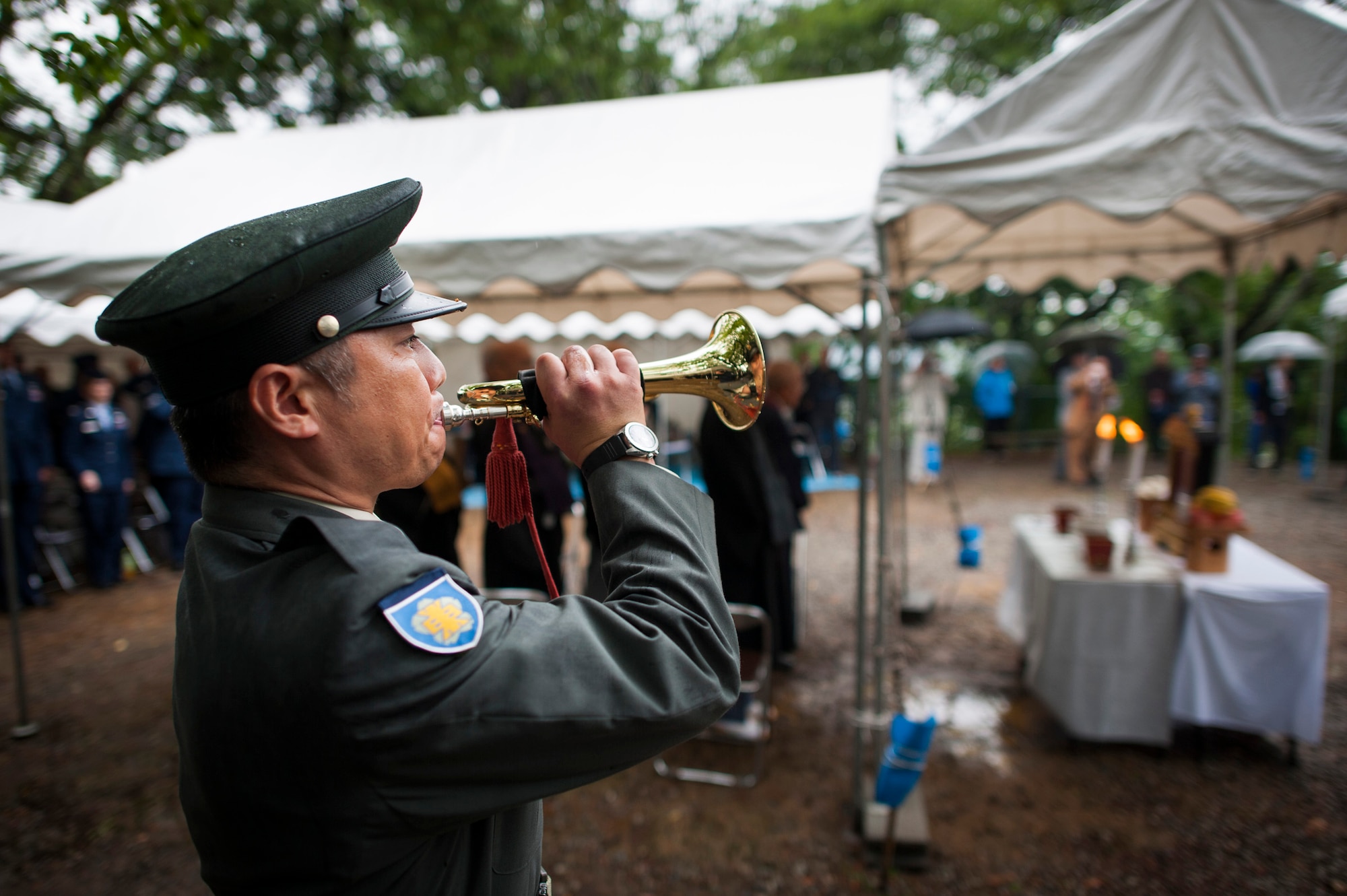 SHIZUOKA, Japan -- Japan Ground Self-Defense Force Sgt. Satoru Ohkura plays Taps at the end of a B-29 memorial ceremony on Mount Shizuhata, Shizuoka, Japan, June 16, 2012. (U.S. Air Force photo by Tech. Sgt. Samuel Morse)