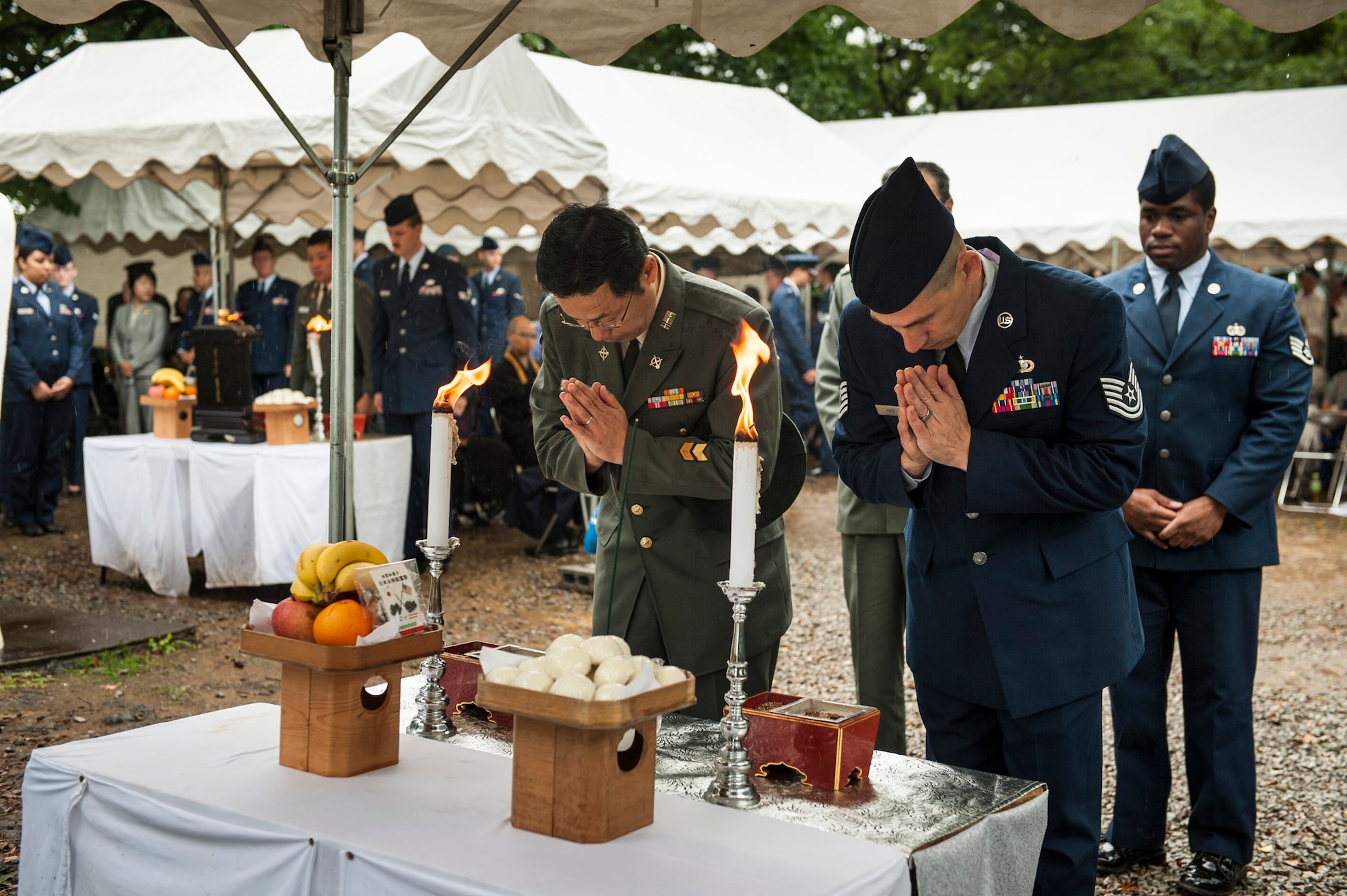 SHIZUOKA, Japan -- Airmen and Japan Ground Self-Defense Force soldiers pay their respects in the Buddhist tradition on Mount Shizuhata, Shizuoka, Japan, June 16, 2012. Americans and Japanese came together to honor those who died on June 19, 1945, during a bombing raid and aircraft collision over Shizuoka. (U.S. Air Force photo by Tech. Sgt. Samuel Morse)