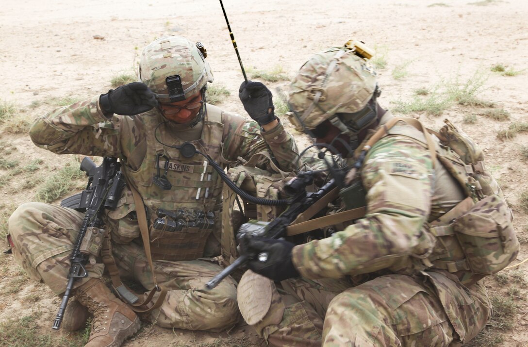 U.S. Army Staff Sgt. Omar Jackson, a platoon sergeant, right, and U.S. Army Pfc. Joshua Haskins, radio telephone operator, try to block the dust during a patrol outside Combat Outpost Zormat in Paktya province, Afghanistan, June 15, 2012. Jackson and Haskins are assigned to Company D, 3rd Battalion, 509th Infantry Regiment.