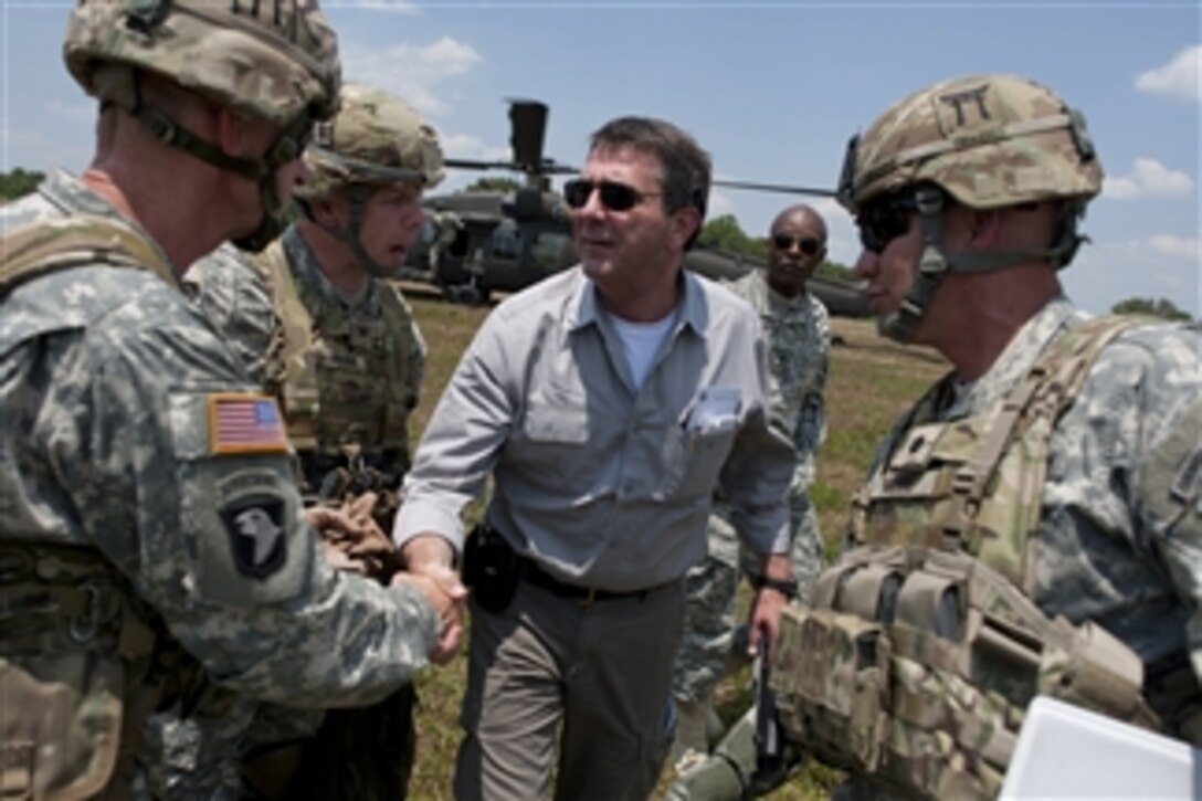 Deputy Secretary of Defense Ashton M. Carter greets soldiers assigned to 101st Airborne Division during a counter Improvised Explosive Device training exercise, on Fort Campbell, Ky., on June 20, 2012.   