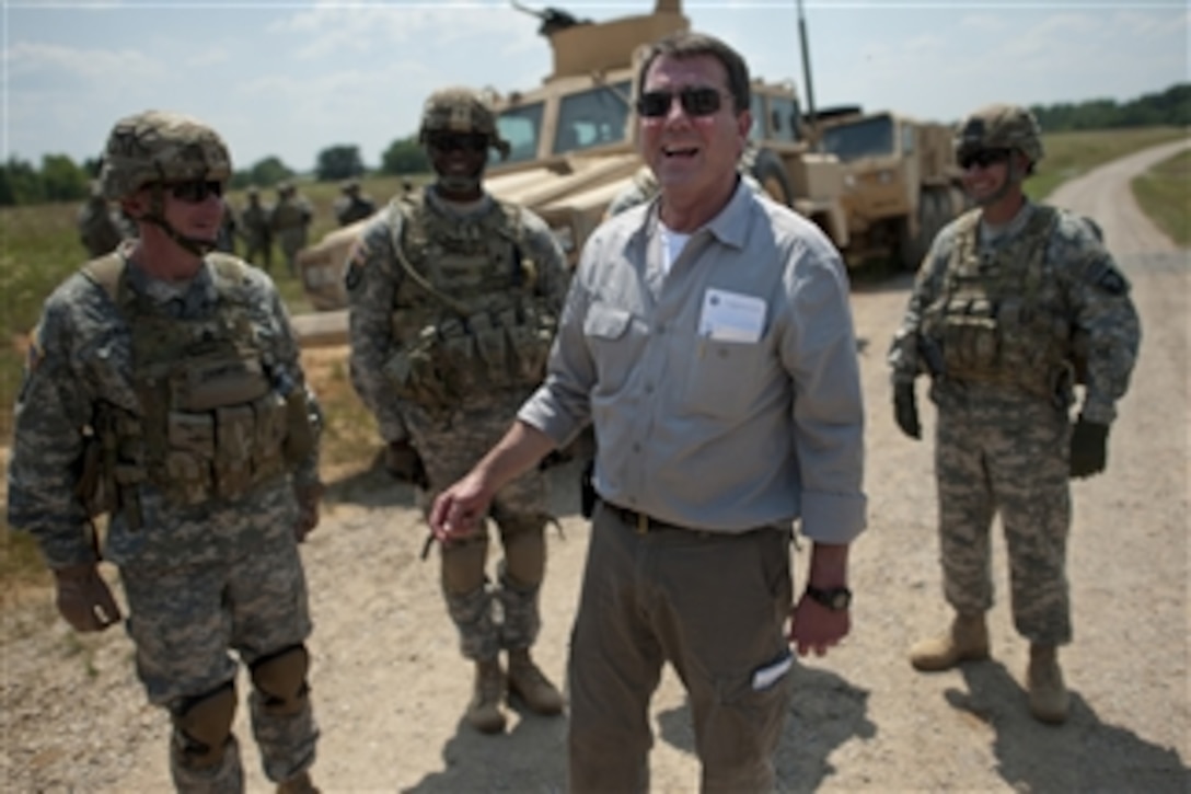 Deputy Secretary of Defense Ashton M. Carter talks with soldiers assigned to 101st Airborne Division during a counter Improvised Explosive Device training exercise, on Fort Campbell, Ky., on June 20, 2012.   