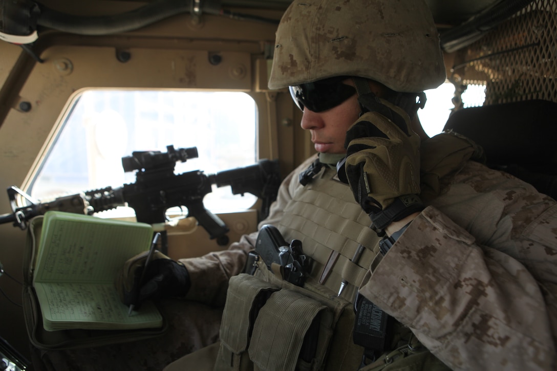 Sgt. Jonathan Broadnax, the Joint Terminal Attack Controller, Fire Support Team, 1st Marine Logistics Group (Forward), communicates with the battlespace owner during a combat logistics patrol in Helmand Province, Afghanistan, June 21. The JTAC is responsible for calling in close-air support, casualty evacuations and securing landing zones when necessary.