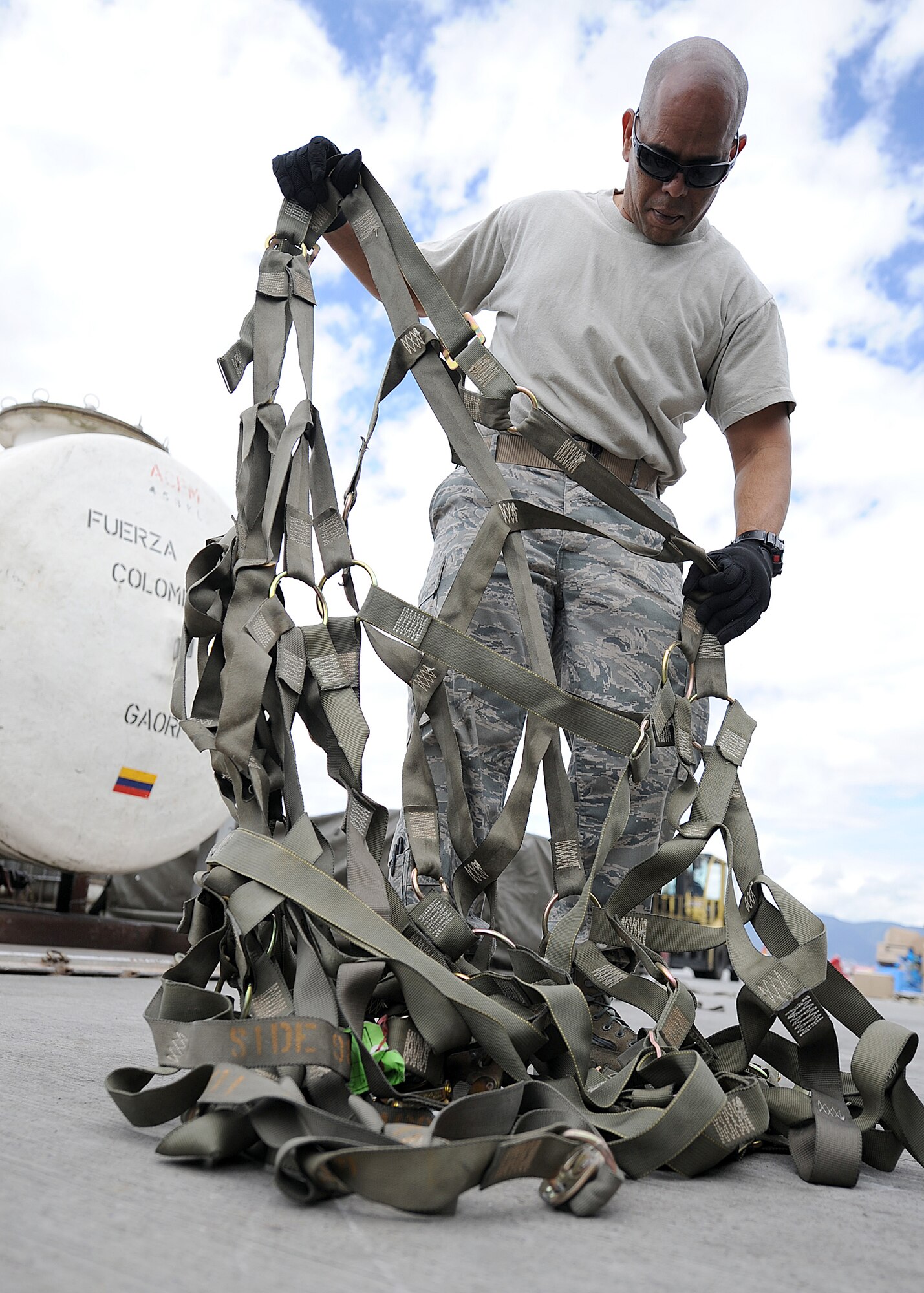 Technical Sgt. Luis Sanchez, 571st Mobility Support Advisory Squadron aircraft maintenance air advisor, does an inventory and a side and top net inspection during an Air Mobility Command Building Partner Capacity mission June 20 at Commando Aéreo de Transporte Militar, Bogota, Colombia.  The MSAS advisors are participating in a mutually beneficial forum for the exchange of ideas between U.S. and Colombian airmen via interactive classroom sessions and hands-on training.  The mission also supports the 12th Air Force’s (AFSOUTH) continued engagements in the U.S. Southern Command area of responsibility of Latin America and the Caribbean.  (U.S. Air Force photo by Tech. Sgt. Lesley Waters)