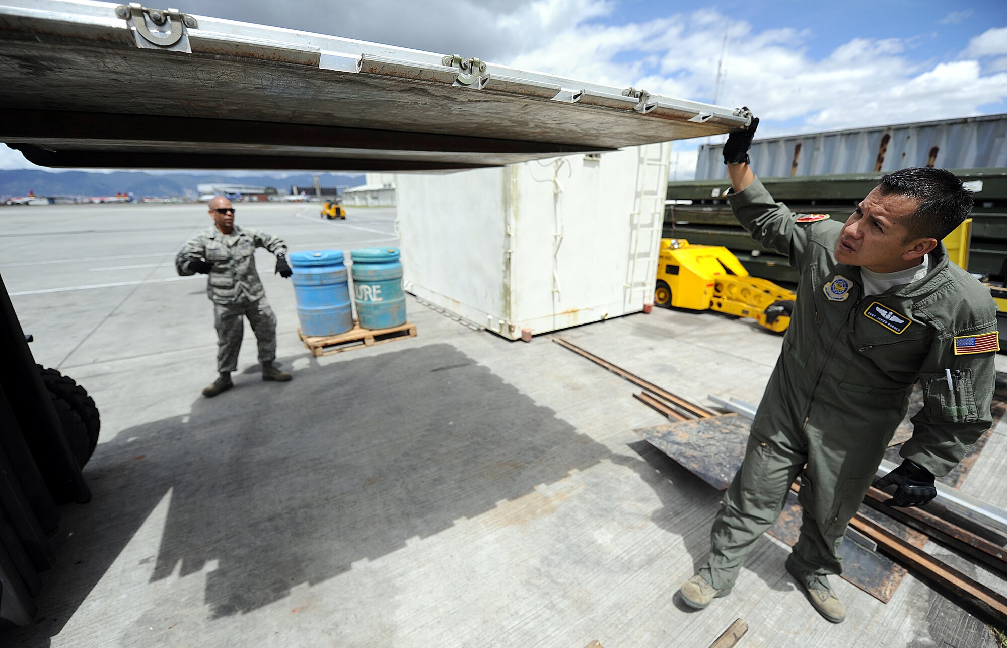 Technical Sgt. Luis Sanchez (left), 571st Mobility Support Advisory Squadron aircraft maintenance air advisor, and Staff Sgt. Javier Borges, 571st MSAS loadmaster air advisor, inspect pallet serviceability during an Air Mobility Command Building Partner Capacity mission June 20 at Commando Aéreo de Transporte Militar, Bogota, Colombia.  The MSAS advisors are participating in a mutually beneficial forum for the exchange of ideas between U.S. and Colombian airmen via interactive classroom sessions and hands-on training.  The mission also supports the 12th Air Force’s (AFSOUTH) continued engagements in the U.S. Southern Command area of responsibility of Latin America and the Caribbean.  (U.S. Air Force photo by Tech. Sgt. Lesley Waters)