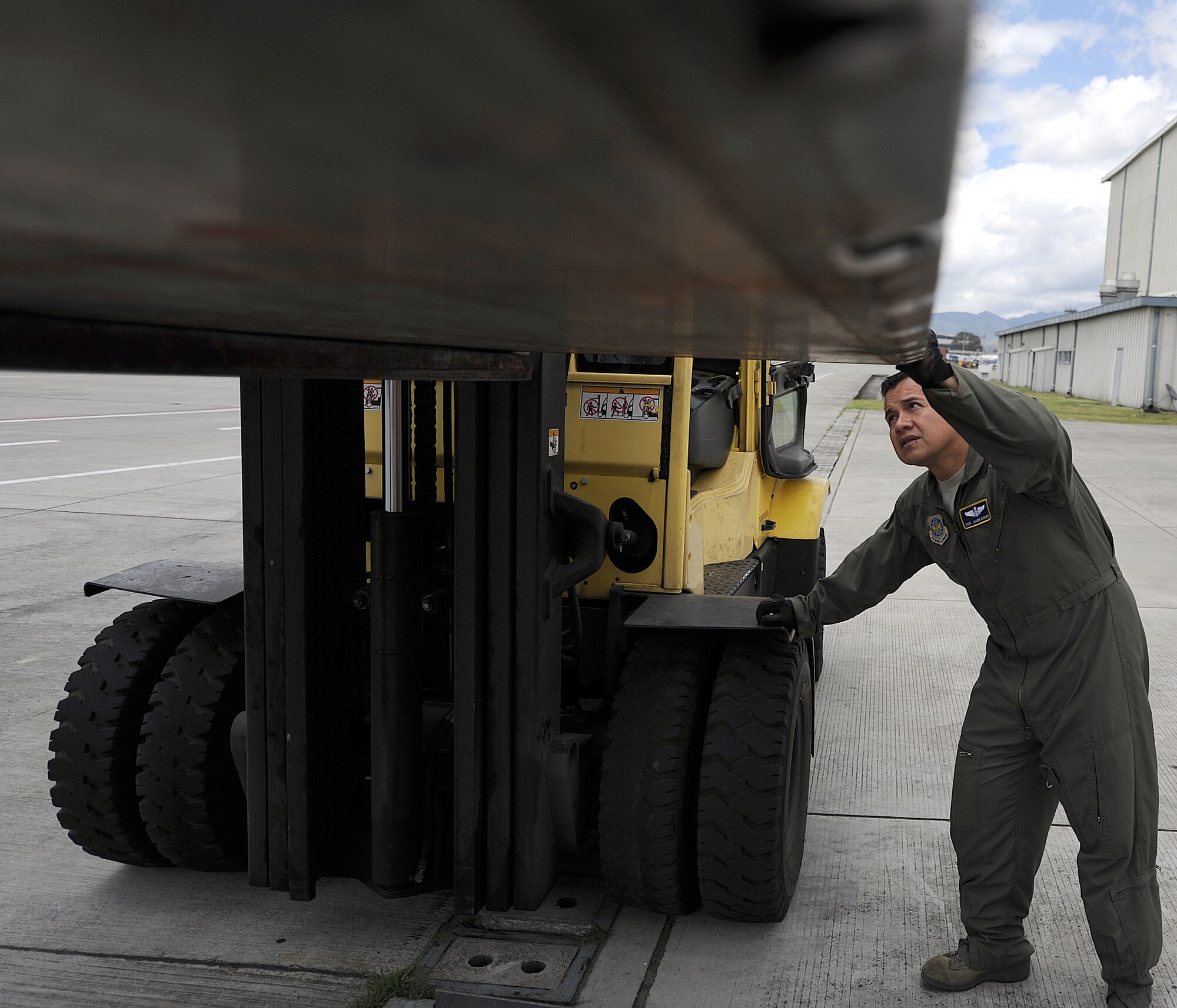 Staff Sgt. Javier Borges, 571st Mobility Support Advisory Squadron loadmaster air advisor, inspects pallet serviceability during an Air Mobility Command Building Partner Capacity mission June 20 at Commando Aéreo de Transporte Militar, Bogota, Colombia.  The 571st is participating in a month-long BPC mission with the Colombian air force to promote regional stability by fostering key relationships and enhancing partner nation capabilities.  The mission also supports the 12th Air Force’s (AFSOUTH) continued engagements in the U.S. Southern Command area of responsibility of Latin America and the Caribbean.  In addition, the 571st reached out to Inter-American Air Forces Academy and 12th AF (AFSOUTH) for assistance to complement their team. (U.S. Air Force photo by Tech. Sgt. Lesley Waters)