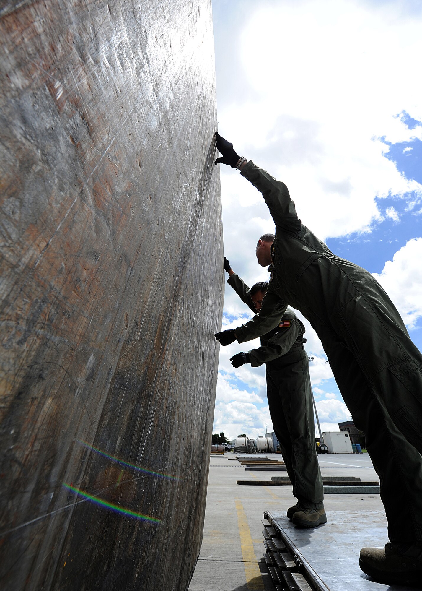 Major Brian Symon (right), 571st Mobility Support Advisory Squadron Colombia mission commander, and Staff Sgt. Javier Borges, 571st MSAS loadmaster air advisor, inspect pallet serviceability during an Air Mobility Command Building Partner Capacity mission June 20 at Commando Aéreo de Transporte Militar, Bogota, Colombia.  The MSAS advisors are participating in a mutually beneficial forum for the exchange of ideas between U.S. and Colombian airmen via interactive classroom sessions and hands-on training.  The mission also supports the 12th Air Force’s (AFSOUTH) continued engagements in the U.S. Southern Command area of responsibility of Latin America and the Caribbean.  (U.S. Air Force photo by Tech. Sgt. Lesley Waters)