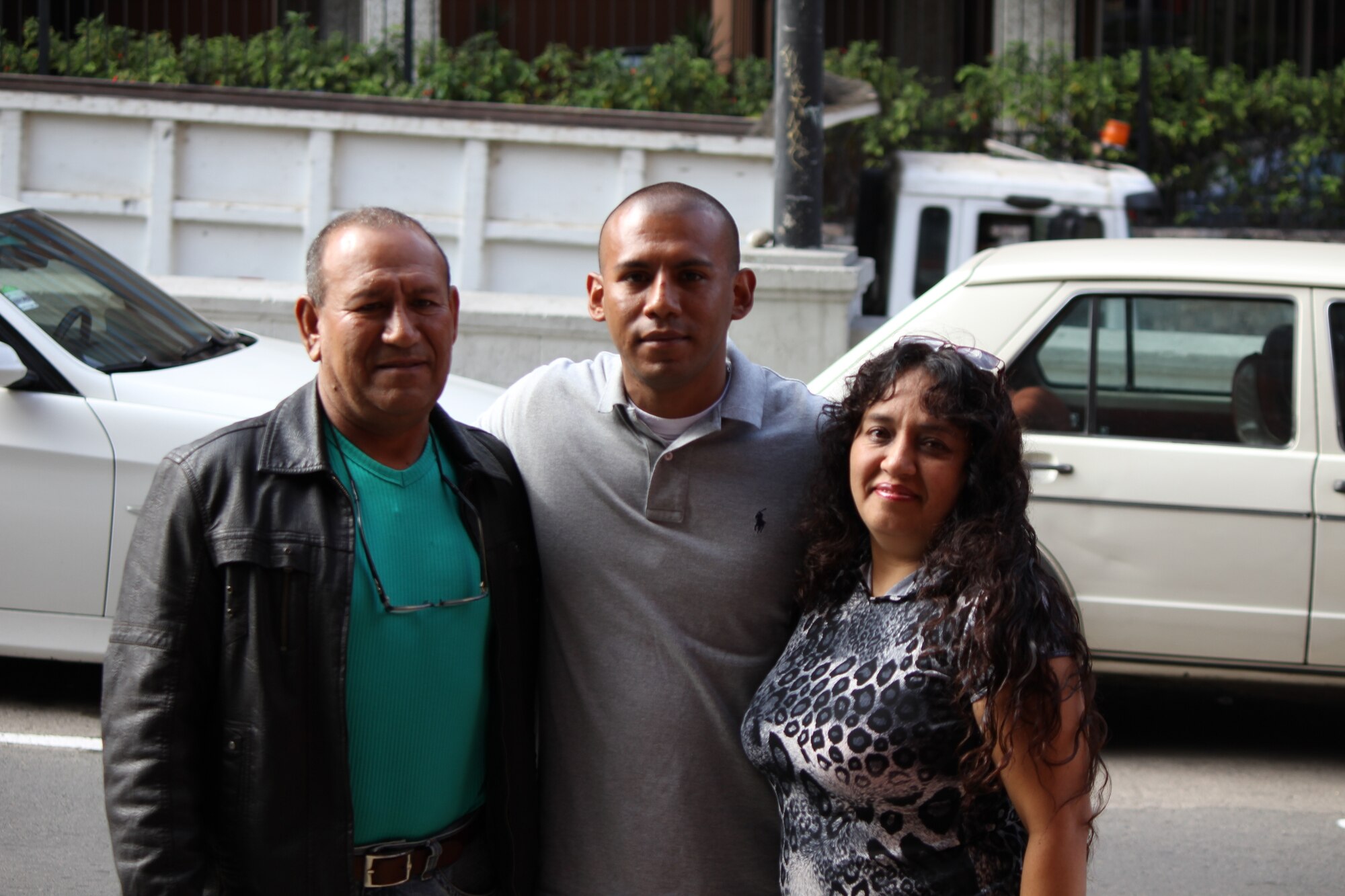 LIMA, Peru—Lance Cpl. Guillermo Muguerza from the 4th Civil Affairs Group deployed for New Horizons 2012, poses with his dad and aunt after being reunited after 15 years apart. New Horizons is an annual U.S. Southern Command-sponsored joint and combined humanitarian assistance and training exercise.  (U.S. Air Force photo by Staff Sgt. Jessica Poppineau/released)