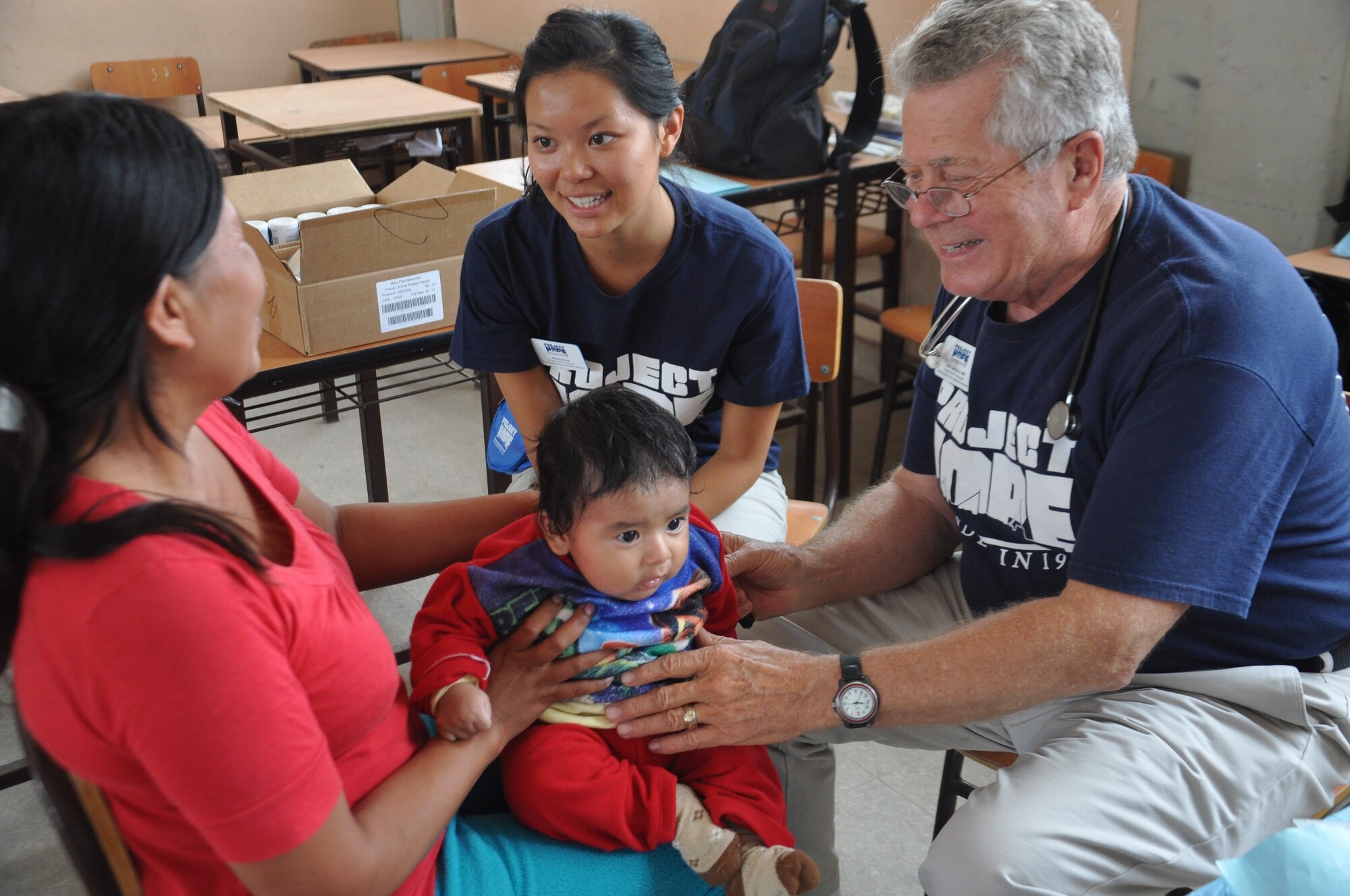 SAN CLEMENTE, Peru—Dr. Alan Jamison attends to a young Peruvian patient while Wendy Song translates to the patient’s mother during a medical readiness and training exercise here June 21 as part of New Horizons Peru 2012. New Horizons is a U.S. Southern Command-sponsored humanitarian assistance and training exercise that takes place annually in Latin American and Caribbean countries.  Jamison and Song are volunteers from Project Hope, a non-governmental organization that has volunteered to work alongside the U.S. military during New Horizons to synergize humanitarian efforts. 
(U.S. Air Force photo by Capt. Candace N. Park/released)
