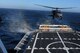 California Air National Guard members assigned to the 129th Rescue Squadron conduct aircraft deck landing qualifications with the United States Coast Guard, approximately 25 nautical miles off the coast of Northern California, June 20, 2012. This is the first landing of an Air Force HH-60G Pave Hawk on the National Security Coast Guard Cutter, USCG Bertholf. (Air National Guard photo by Staff Sgt. Kim E. Ramirez)