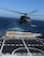 California Air National Guard members assigned to the 129th Rescue Squadron conduct aircraft deck landing qualifications with the United States Coast Guard, approximately 25 nautical miles off the coast of Northern California, June 20, 2012. This is the first landing of an Air Force HH-60G Pave Hawk on the National Security Coast Guard Cutter, USCG Bertholf. (Air National Guard photo by Staff Sgt. Kim E. Ramirez)