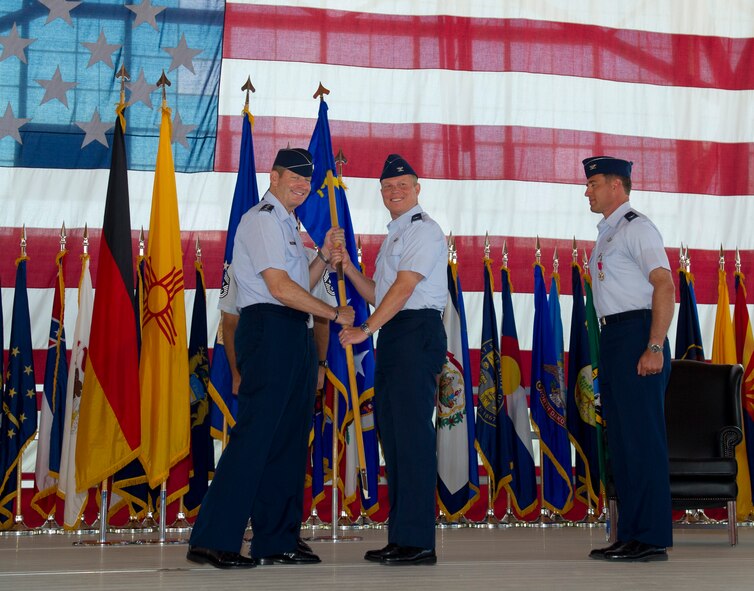Colonel Andrew Croft, incoming 49th Wing commander, takes command of the 49th WG during the 49th WG change of command ceremony at Holloman Air Force Base, N.M., June 22. Croft will be the second commander of the 49th WG since it changed from the 49th Fighter Wing in June of 2010. Croft was previously the commander of the 12th Operations Group, Joint Base San Antonio-Randolph, Texas. (U.S. Air Force Photo by Airman 1st Class Michael Shoemaker/Released)