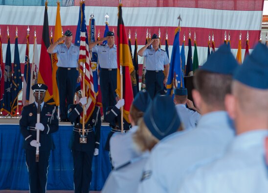 Lieutenant Gen. Robin Rand, 12th Air Force commander; Col. David Krumm, outgoing 49th Wing commander; and Col. Andrew Croft, incoming 49th WG commander, salute the flag during playing of the national anthem at the 49th WG change of command ceremony at Holloman Air Force Base, N.M., June 22. Croft was previously the 12th Operations Group commander at Joint Base San Antonio-Randolph, Texas. The salute is one of the military's most time-honored traditions and one of the most recognized signs of respect.  (U.S. Air Force photo by Airman 1st Class Colin Cates/Released) 