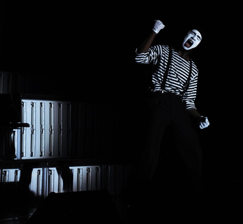 A member of Tops in Blue performs a mime routine during a show at Beale Air Force Base, Calif., June 16, 2012. TIB perform approximately 130 shows yearly for military personnel and their families.  (U.S. Air Force photo by Staff Sgt. Robert M. Trujillo/Released)