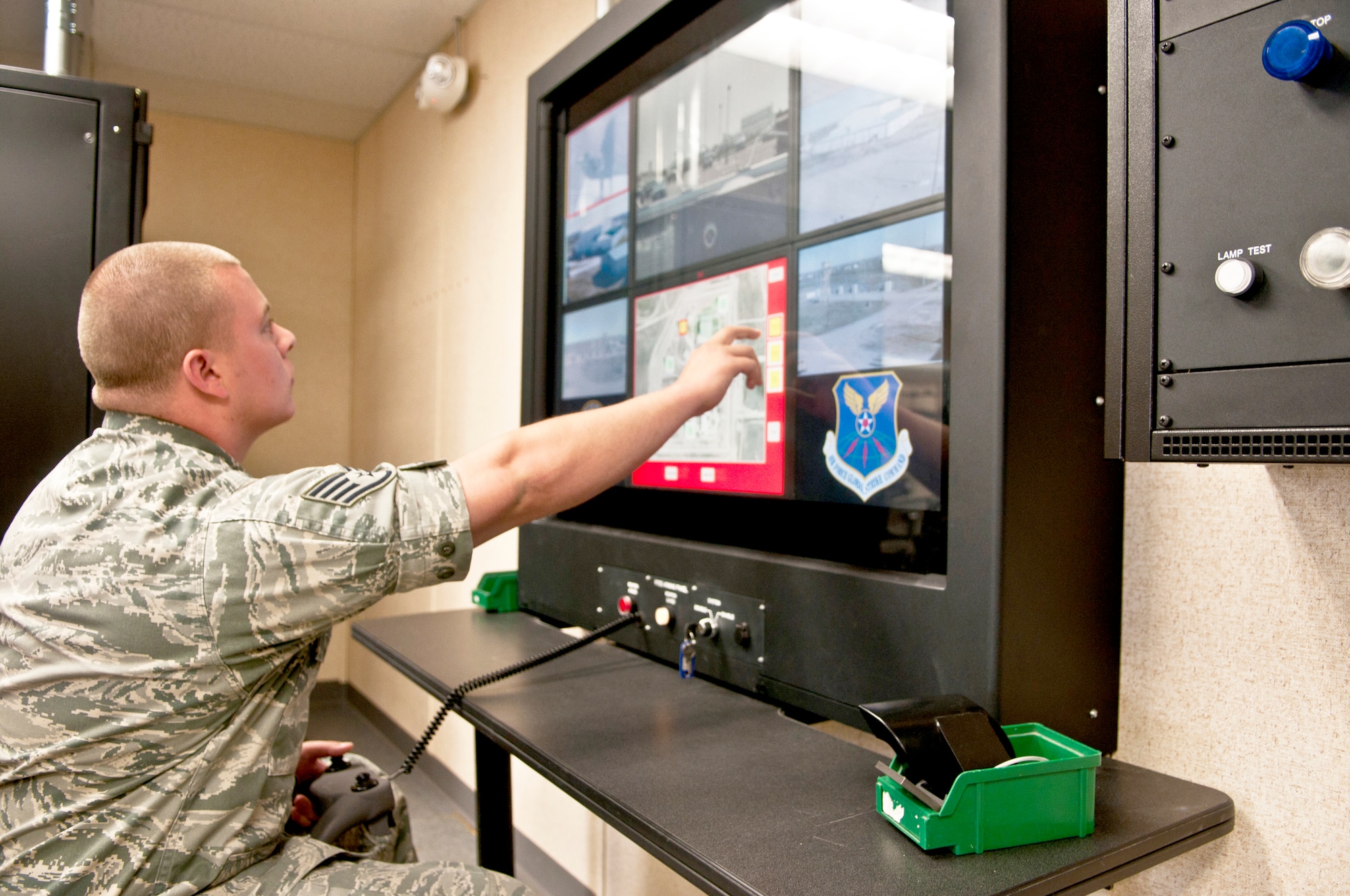Staff Sgt. Zach Busche, 90th Communications Squadron Visual Imagery and Intrusion Detection Systems technician, performs an operational check on the Remote Targeting Engagement System in Building 1250 June 18. The RTES is one of several defense systems to protect areas of F. E. Warren Air Force Base. (U.S. Air Force Photo by Airman 1st Class Jason Wiese)