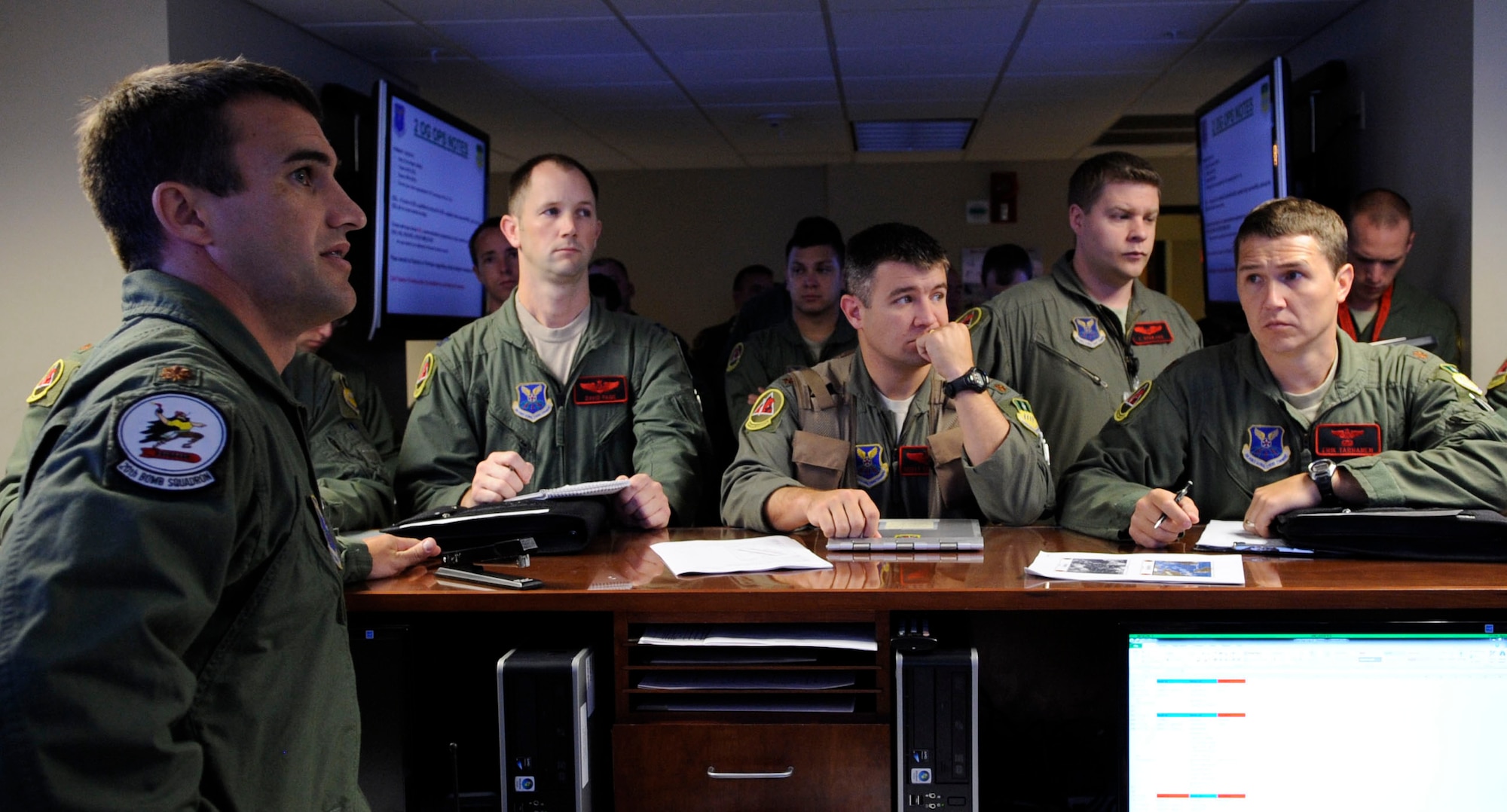 Maj. Jon Lee, 20th Bomb Squadron operational supervisor, briefs aircrew members before a mission on Barksdale Air Force Base, La., June 20. Aircrew members participated in a 17-hour Joint Chiefs of Staff-directed exercise and were pre-briefed on flight plans and details about the mission. (U.S. Air Force photo/Airman 1st Class Joseph A. Pagán Jr.)(RELEASED)