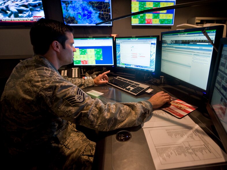 Staff Sgt. James Hulett, 2nd Maintenance Operations Squadron, reviews maintenance data in the Maintenance Operations Center on Barksdale Air Force Base, La., June 22. Maintenance operational controllers in the MOC relay the information to the correct organizations, such as maintenance teams on the flightline, wing safety and others. (U.S. Air Force photo/Staff Sgt. Chad Warren)(RELEASED)
