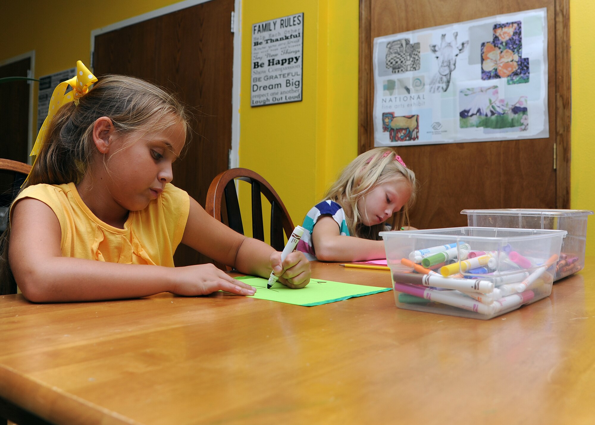 ALTUS AIR FORCE BASE, Okla. – Children draw pictures during the school-age program at the base Youth Center June 19, 2012. The standard school-age program is available weekdays from 2 p.m. to 6 p.m. A new summer Open Recreation program is available weekdays from 8:30 a.m. to 2 p.m. for children ages 9 to 18-years-old. The new program encourages to do fitness-fun activities. (U.S. Air Force photo by Airman Klynne Pearl Serrano / 97th Air Mobility Wing Public Affairs / Released)