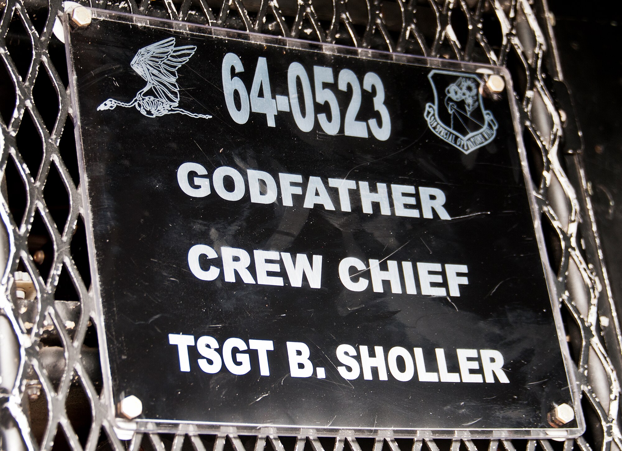 Aircraft 64-0523’s name plate shows the aircraft’s nickname and the current crew chief.  The aircraft never officially had a nickname until it was given the name “Godfather” by Rick Andreozzi, who was its first crew chief when it arrived to Duke Field in 2000.  0523 lead the Air Force’s assault force during the Son Tay Raid to rescue prisoners of war in Vietnam in 1970.  (U.S. Air Force photo/Tech. Sgt. Samuel King Jr.)