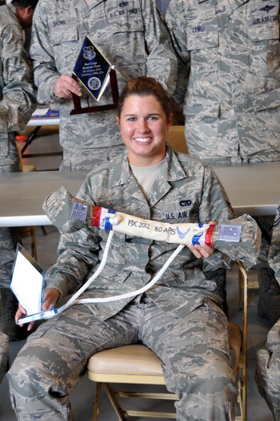 Senior Airman Stephanie Luckett shows off the 80th Aerial Port Squadron Dawg bone.  Dobbins Air Reserve Base hosted the Air Force Reserve Command Port Dawg Challenge June 19-21. (U.S. Air Force photo/Senior Airman Elizabeth Gaston)