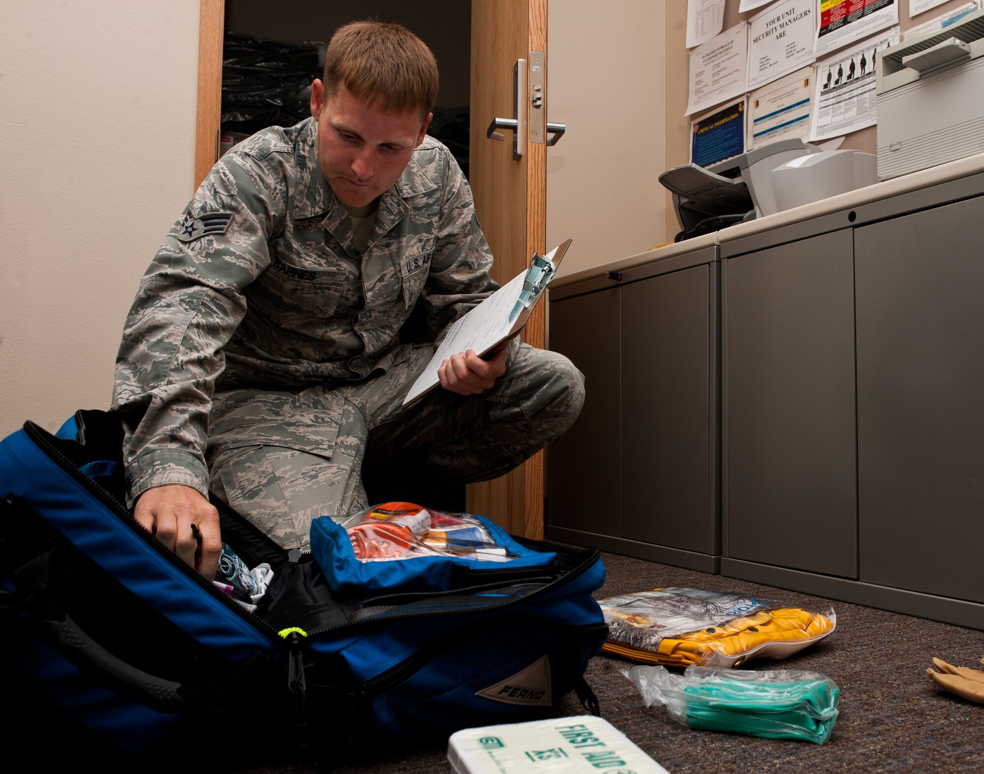 Senior Airman Bradley Barnes, 28th Bomb Wing ground safety technician, inventories items inside of a rapid response bag during quarterly inspections at Ellsworth Air Force Base, S.D., June 20, 2012. The 28th BW safety section uses rapid response bags when a major accident occurs there is a need to immediately respond to secure the scene and recover data to prepare for an investigation. (U.S. Air Force photo by Airman 1st Class Alystria Maurer/Released)