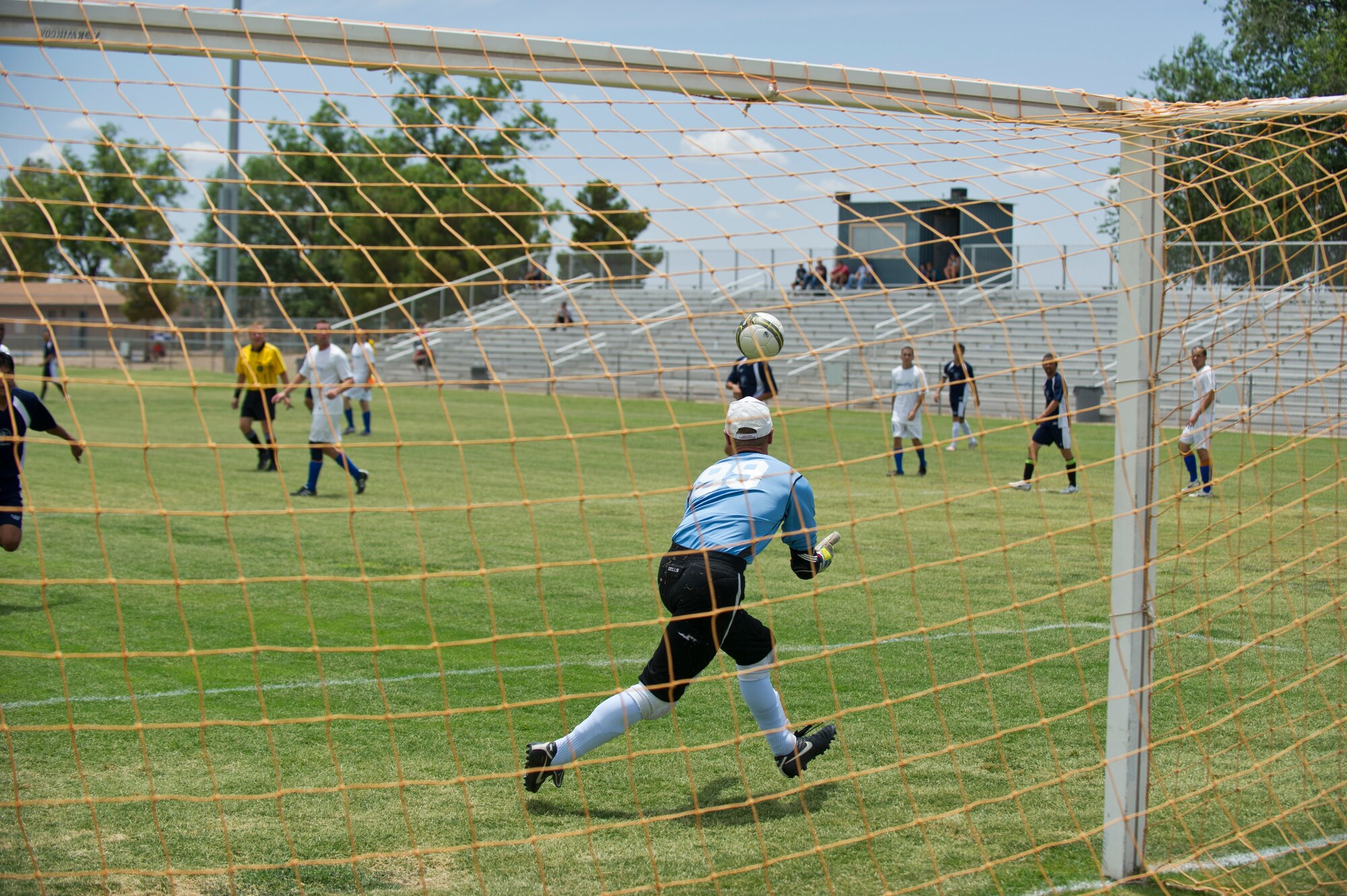 Sam Hilgart from the German Air Force Flying Training Center, catches the ball for a save at Mayfield High School, Las Cruces, N.M., June 16. Hilgart’s stellar performance and numerous saves made the difference between winning and losing the championship for Team Holloman. (U.S. Air Force photo by Airman 1st Class Daniel E. Liddicoet/Released)