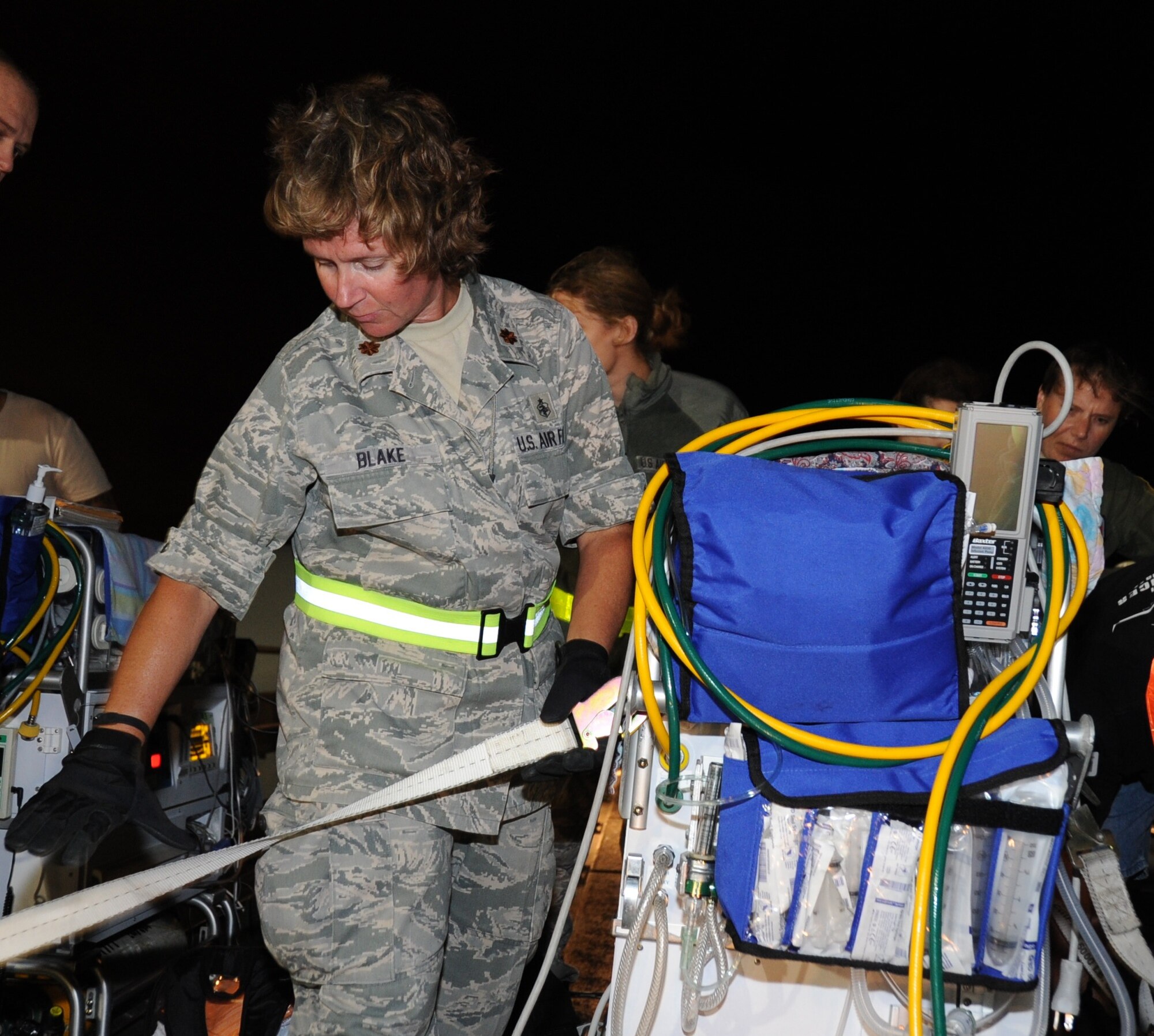JOINT BASE PEARL HARBOR-HICKAM, Hawaii – Maj. Jill Blake, 442nd Medical Squadron, medical administration flight commander, secures an incubator during transfer from a KC-135 Stratotanker to an awaiting ambulance here, June 21, 2012. Blake is on temporary duty working and training in various positions on the installation. The 442nd MDS is part of the 442nd Fighter Wing, an A-10 Thunderbolt II Air Force Reserve unit at Whiteman Air Force Base, Mo. (U.S. Air Force photo/Staff Sgt. Lauren Padden)