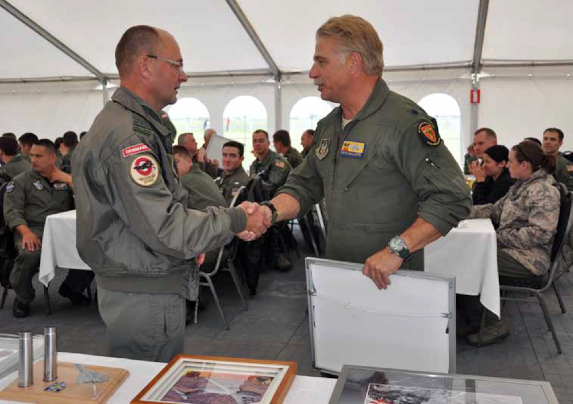 Lt. Col. Keith Guillotte, pilot, 729th Airlift Squadron, was recognized and given a
framed photo from the Aalborg base commander as a token of appreciation for attending the airshow. Guillotte received the request to attend and worked feverishly
to plan and organize the entire trip. The 729th AS has already been invited back
to Aalborg for the 2018 airshow. (U.S. Air Force photo by Staff Sgt. Megan Crusher)