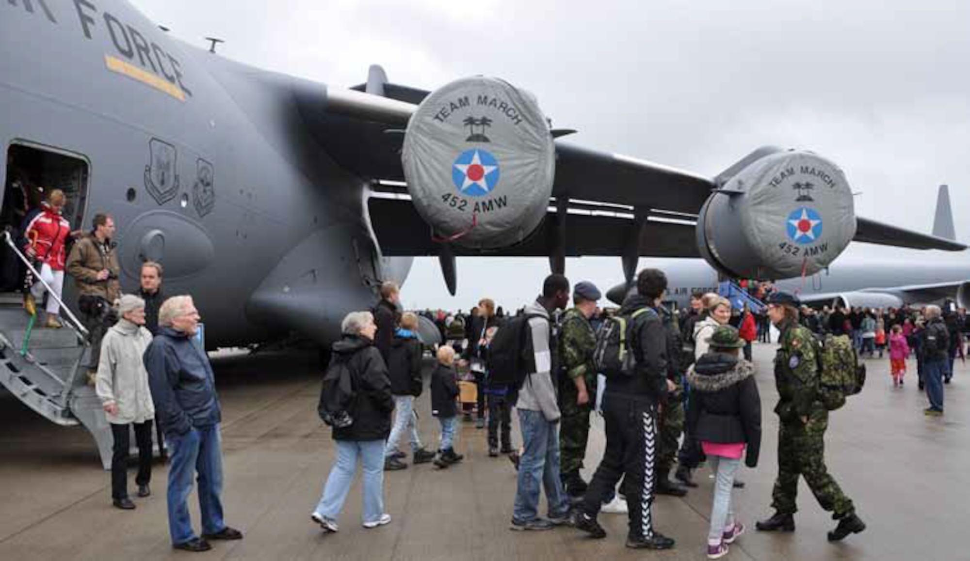 Cold, rainy weather wasn’t enough to deter large crowds from attending the Royal
Danish Air Force airshow at Aalborg Air Base, Denmark, June 10. The March Air
Reserve Base C-17 Globemaster III was constantly full of people who were awed
by the enormous jet which stood out in comparison to the other jets at the airshow. (U.S. Air Force photo by Staff Sgt. Megan Crusher)