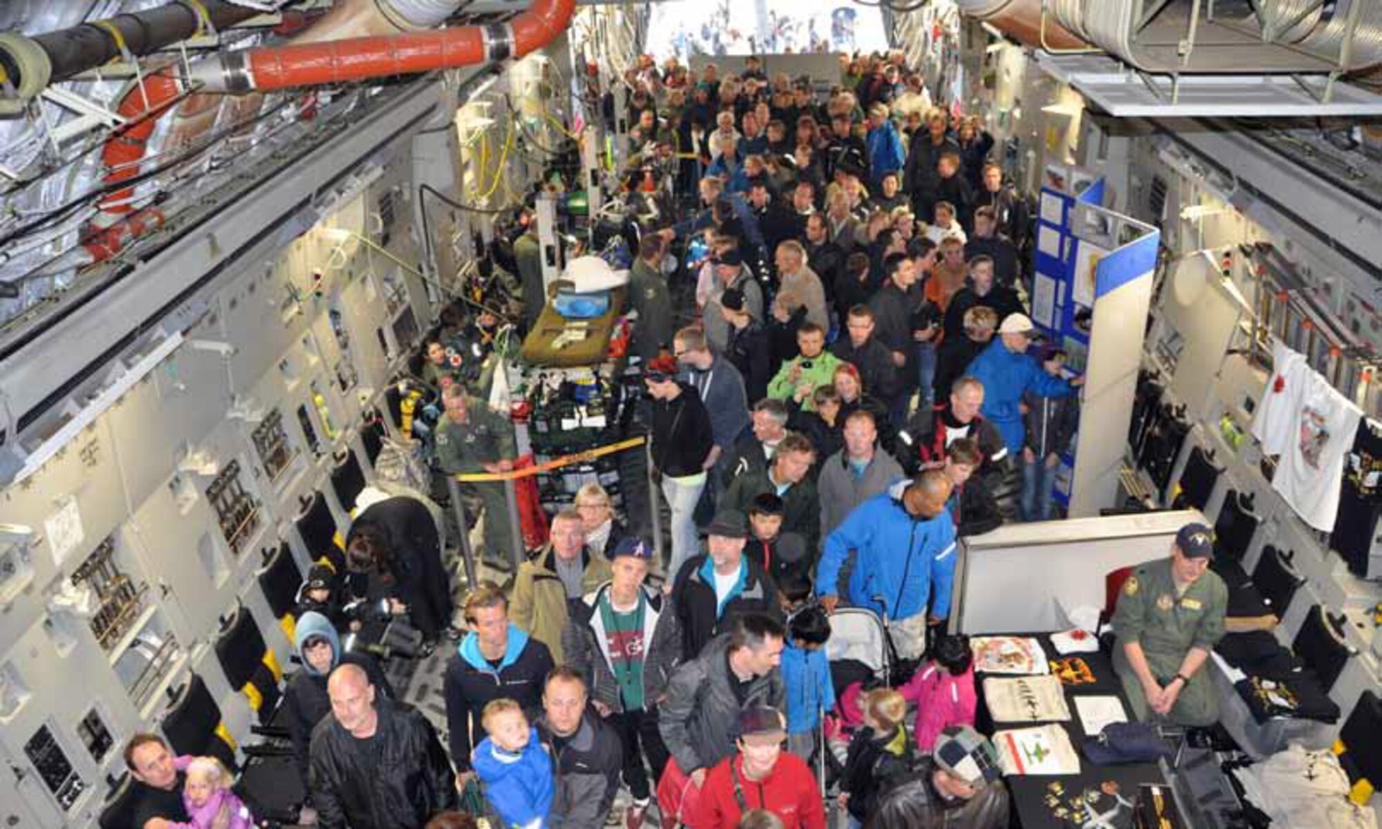 The March Air Reserve Base C-17 Globemaster III was a very popular attraction and
constantly full of excited fans during the Royal Danish Air Force Airshow at Aalborg Air
Base, Denmark, June 10. From 9 a.m. to 5 p.m., civilians and military from all over the
world lined up in the rain to get their chance to walk inside the cargo bay. While inside,  they were able to take photos and talk to the pilots and loadmasters about the aircraft. Visitors were also able to view the 452 Aeromedical Evacuation Squadron’s air evacuation configuration used when transporting injured troops out of deployed locations. (U.S. Air Force photo by Staff Sgt. Megan Crusher)