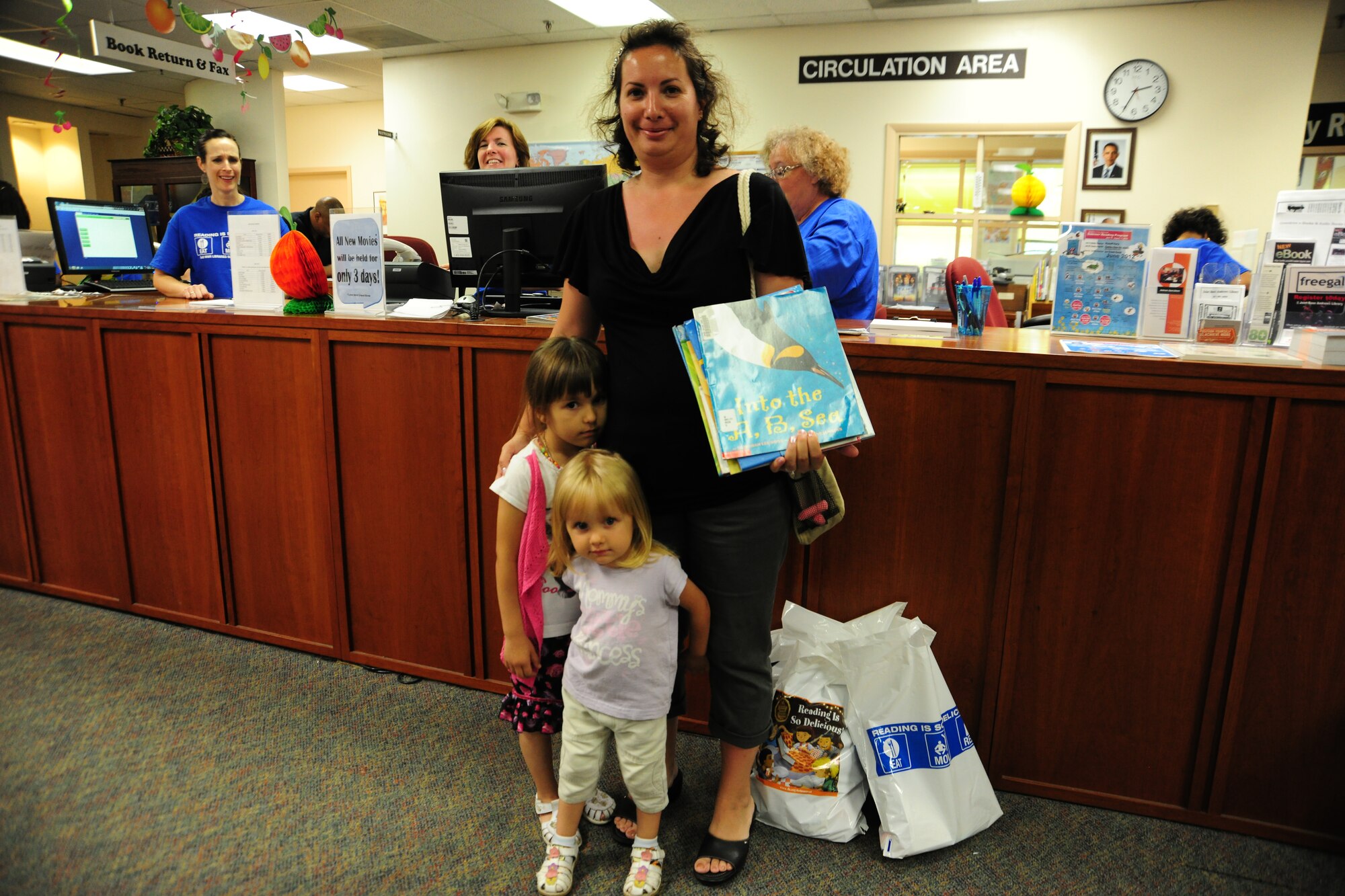 Team Andrews members enjoy arts and crafts, computer games, gift-bag giveaways and a smorgasbord of books during opening day of the Summer Reading program at the Joint Base Andrews library on June 18, 2012. The Summer Reading Program motivates, inspires and teaches individuals of all ages to read as much as possible. (U.S. Air Force photo/Senior Airman Amber Russell)