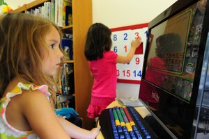 Team Andrews members enjoy arts and crafts, computer games, gift-bag giveaways and a smorgasbord of books during opening day of the Summer Reading program at the Joint Base Andrews library on June 18, 2012. The Summer Reading Program motivates, inspires and teaches individuals of all ages to read as much as possible.(U.S. Air Force photo/Senior Airman Amber Russell)