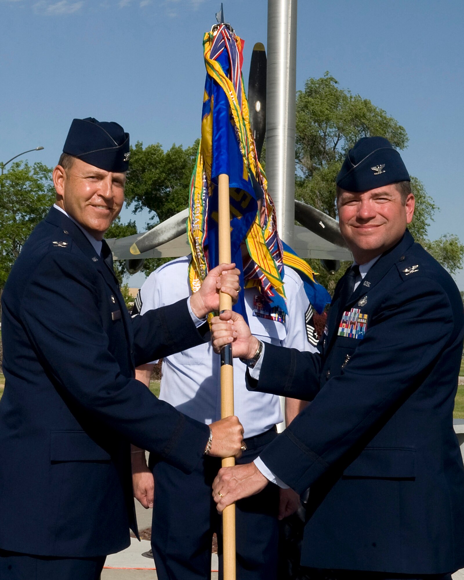 U.S. Air Force Col. Christopher Short, 366th Fighter Wing commander, passes the 366th Mission Support Group guidon to Col. Steven Griswold, incoming 366th MSG commander, during a change of command ceremony June 22, 2012, at Mountain Home Air Force Base, Idaho. Griswold was previously the Dean of Students, Air War College, Maxwell Air Force Base, Alabama, which is directly responsible to the Commandant for all student operations to include morale and welfare, discipline, evaluations and assignments. (U.S. Air Force photo/Staff Sgt. Roy Lynch)