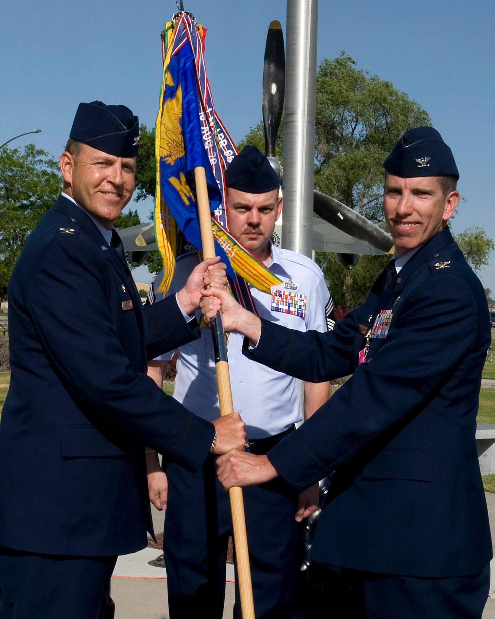 U.S. Air Force Col. Christopher Short, 366th Fighter Wing commander, receives the 366th Mission Support Group guidon from Col. Scott Moser, 366th MSG outgoing commander, during a change of command ceremony June 22, 2012, at Mountain Home Air Force Base, Idaho. Moser will be Chief Information Officer for the U.S. Alaskan Command at Elmendorf Air Force Base, Alaska, which is a sub-unified command of U.S. Pacific Command, and responsible for integrating military activities within Alaska to maintain mission assurance, maximize the readiness of theater forces, and expedite the deployment and redeployment of forces in support of contingencies. (U.S. Air Force photo/ Staff Sgt. Roy Lynch)