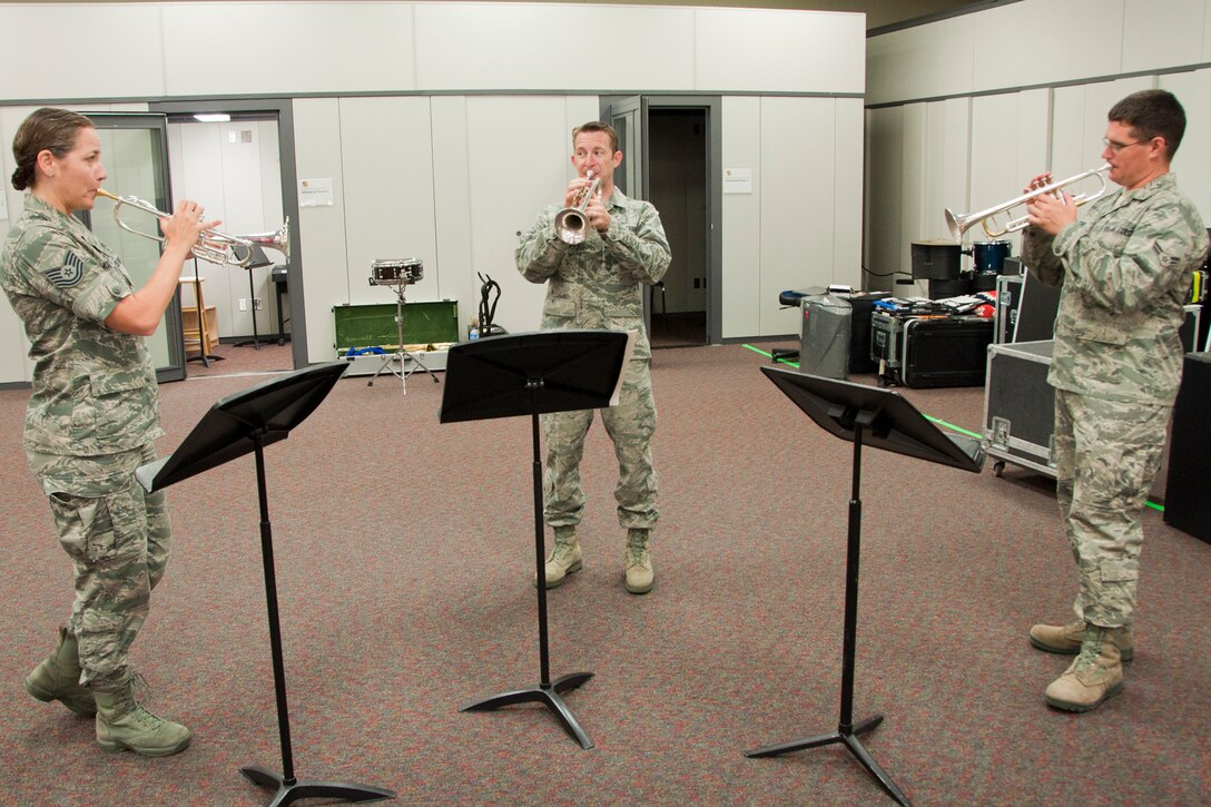 ROBINS AIR FORCE BASE, Ga. – Tech. Sgt. Amy Moran, trumpet section leader and noncommissioned officer in charge of public affairs for the Band of the U.S. Air Force Reserve, Airman 1st Class Mark Oates, trumpet player, and Airman 1st Class Will McCrary, trumpet player, practice the trumpet for the Independence Day Concert June 21, 2012. The IDC is an annual event that brings in members of the community to see performances from the Band and other big names in music. This year, Josh Turner and Tech. Sgt. Angie Johnson are performing with the Band July 2, 2012. (U.S. Air Force photo by Staff Sgt. Megan Tomkins)