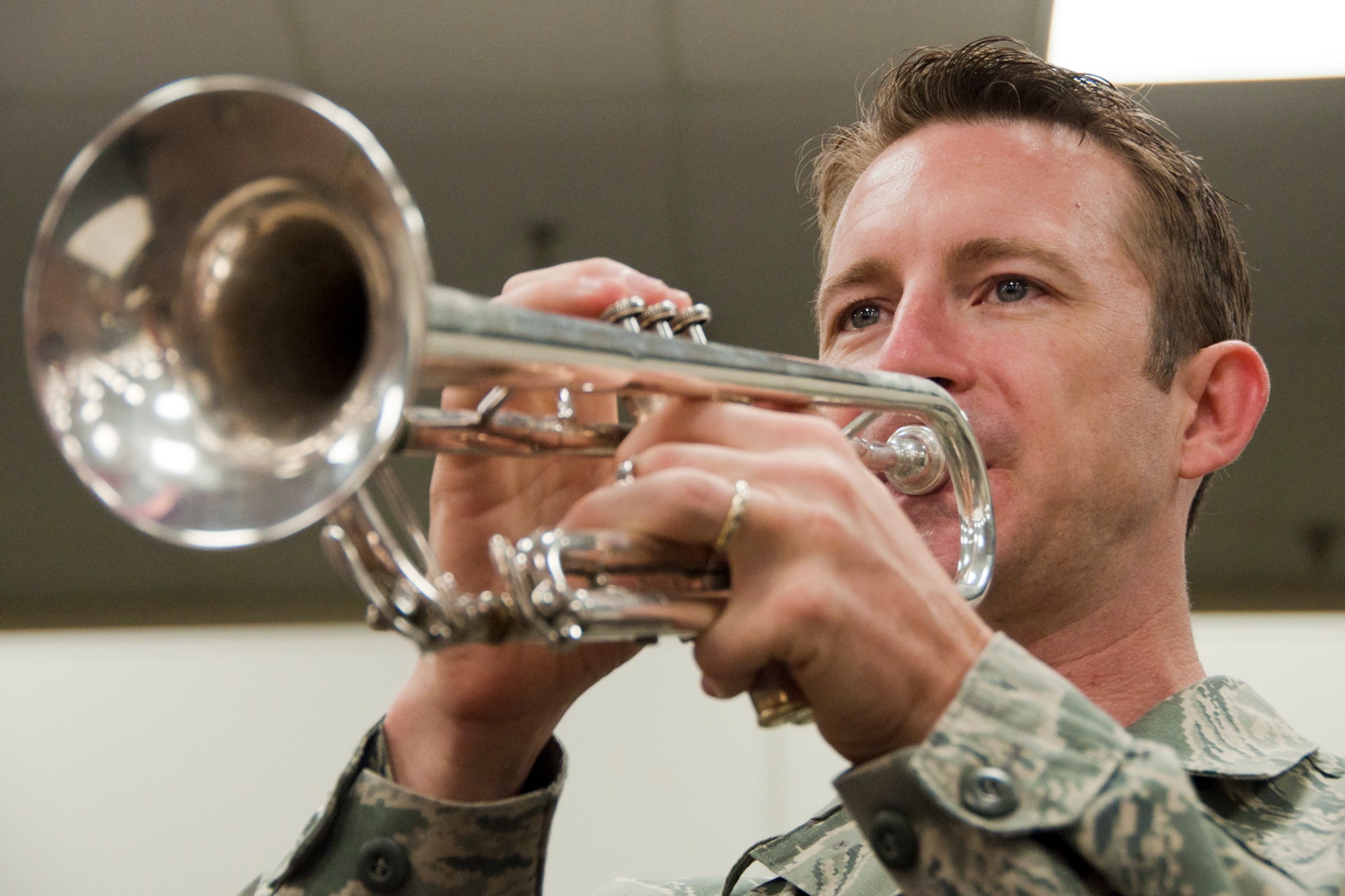 ROBINS AIR FORCE BASE, Ga. – Airman 1st Class Mark Oates, trumpet player with the Band of the U.S. Air Force Reserve, practices the trumpet for the Independence Day Concert June 21, 2012. Oates is a part of the ensemble, High Flight, a 10-piece rock/popular music group, and is playing in his first and last IDC July 2, 2012. (U.S. Air Force photo by Staff Sgt. Megan Tomkins)