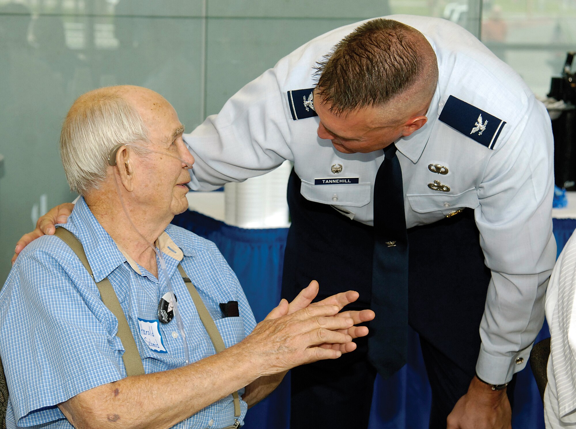 Col. Brad Tannehill, Tinker’s 76th Aircraft Maintenance Group commander, visits with World War II Navy Coxswain veteran Harold Schmid, before the June 5 Oklahoma Honor Flight No. 8 recognition ceremony at Rose State Performing Arts Center.  Mr. Schmid, Edmond, was one of 101 veterans recognized before their trip the next morning to Washington, D.C., to visit memorials dedicated to their service.   (Air Force photo by Margo Wright)