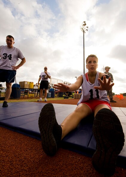 Airman 1st Class Emily Purvis, 7th Civil Engineer Squadron, performs sit-ups June 20, 2012, during the Dyess Warrior Challenge at Dyess Air Force Base, Texas. The challenge consisted of teams and individual competitors who completed a variety of exercises while being timed. Teams of four completed squats, burpees and sit-ups together, and ran two miles as a pack. Individual participants completed two 400-meter laps, sit-ups, push-ups, burpees and a water jug carry. (U.S. Air Force graphic by Airman 1st Class Damon Kasberg/Released)