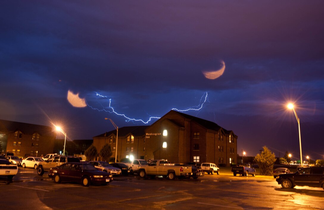 Lighting from an approaching thunderstorm fills the sky at Ellsworth Air Force Base, S.D., June 9, 2012. Thunderstorms, usually associated with severe winds, occur on average once every 45 days during the summer months. Airmen and their families should be prepared for all types of inclement weather and know the location of the nearest emergency shelter. (U.S. Air Force photo by Airman 1st Class Zachary Hada/Released)
