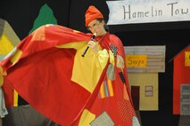 KIRTLAND AFB, N.M. -- Emilea Eckart, as the Pied Piper, plays her flute during a June 15 performance by members of the Kirtland AFB Youth Center. The production is one of several events the center has planned for this summer. (Photo by Ken Moore)