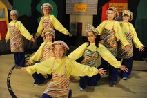 KIRTLAND AFB, N.M. -- Members of the Kirtland AFB Youth Center perform as cooks during a June 15 production of “The Pied Piper.” The cooks were, back row, left to right, Caroline Hall, Alexis Cardoso, Riley Littlefield and Jordan Summers; middle row, Dawn Monique Cantu and Daisy Belmares, front row, Elleanor Patrick. (Photo by Ken Moore)
