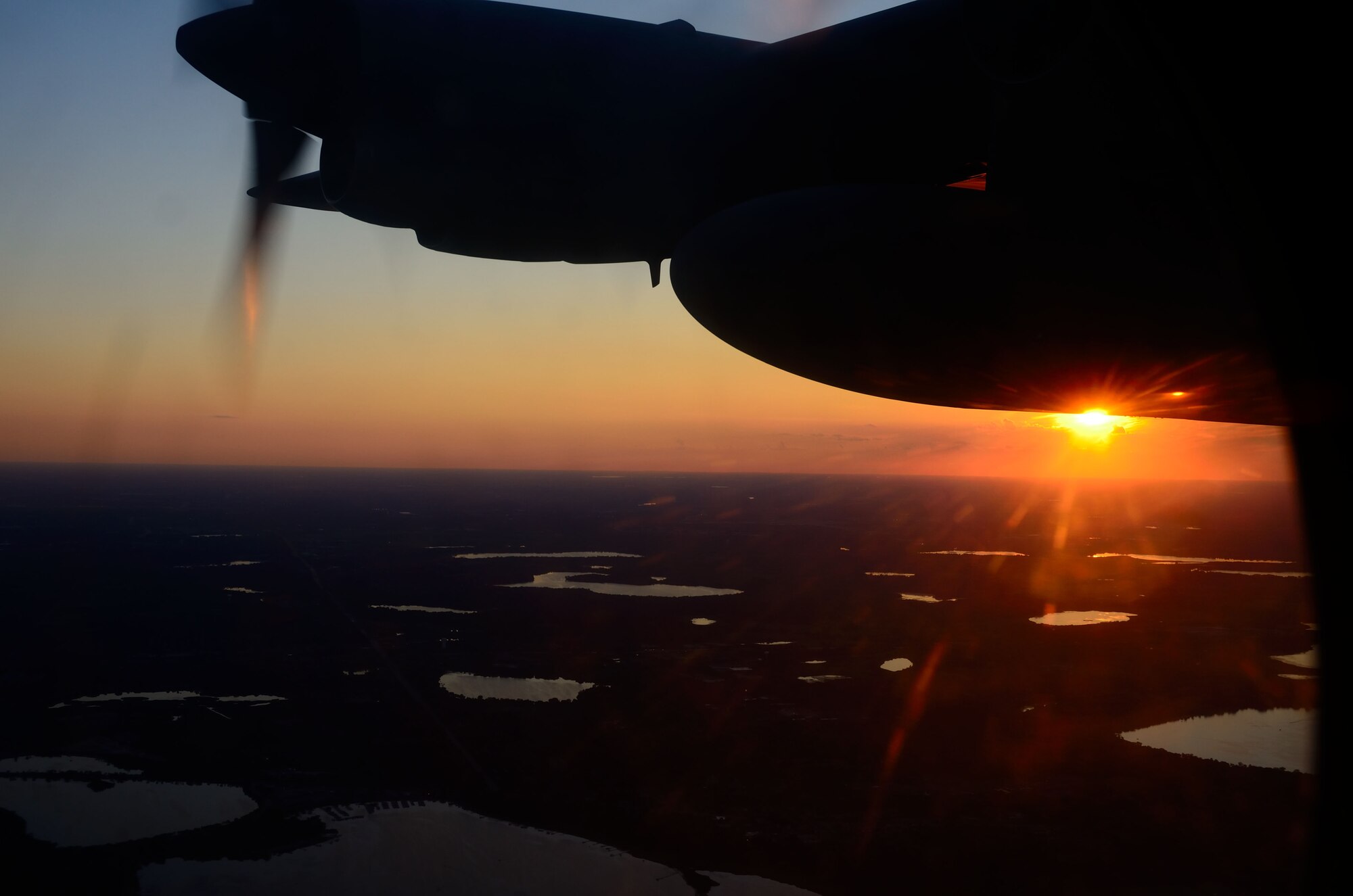 Students attending the Minnesota Aviation Career Education Camp got a chance to take a flight in a 934th Airlift Wing C-130 Hercules and take in sights like a Minnesota sunset by air. ACE Camp is a week-long, residential camp for high school students going into 10th through 12th grades. The camp allows students to explore many different careers in the aviation field, including piloting, air traffic control, engineering, and the military. Minneapolis-St. Paul Air Reserve Station, Minn. (U.S. Air Force photo by Tech. Sgt. Bob Sommer)