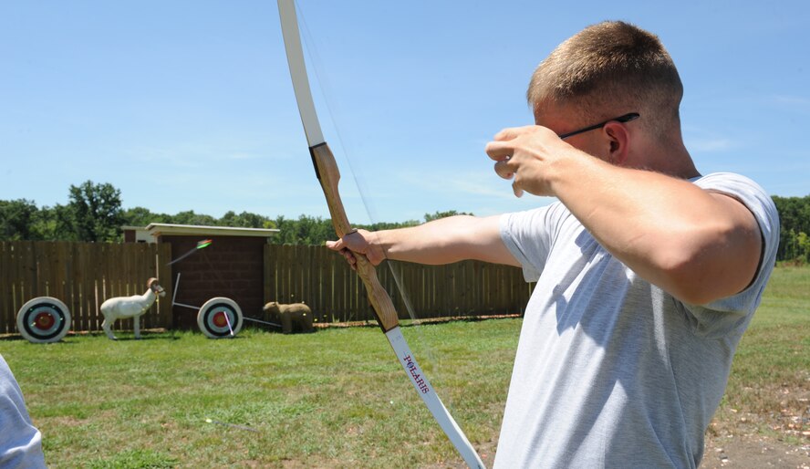 Airman 1st Class Joseph Morris, 2nd Munitions Squadron armament systems journeyman, fires an arrow at a target at the 3D Archery range on Barksdale Air Force Base, La., June 20. The archery event kicked off the Air Force Global Strike Command and American300 Warrior Tours "Do Something Amazing Outdoors" summer challenge. Airmen are encouraged to post their stories, photos and videos of their summer activities on the American300 facebook page. (U.S. Air Force photo/Airman 1st Class Benjamin Gonsier)(RELEASED)
