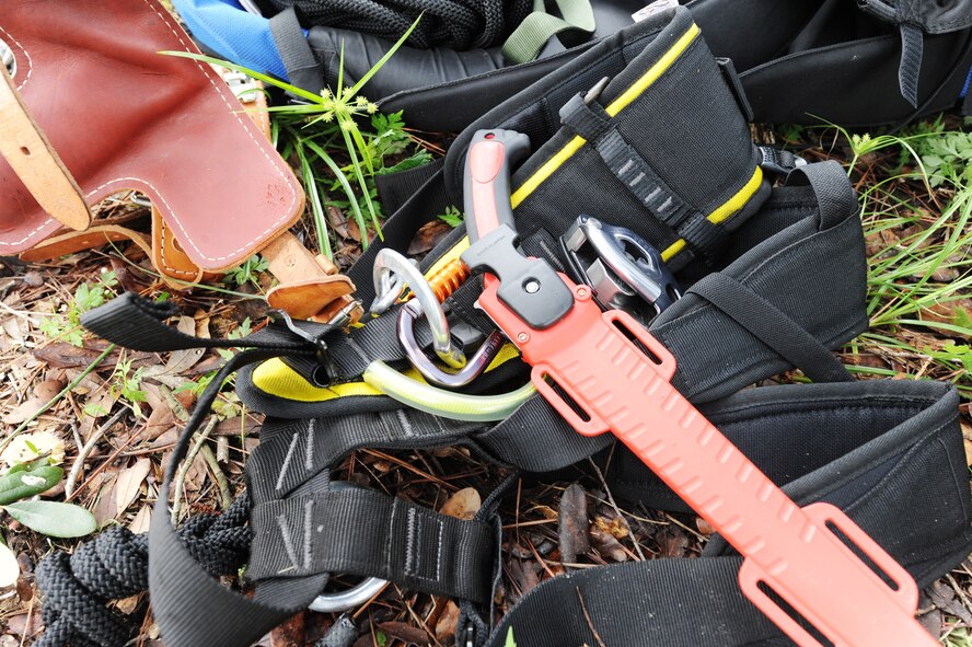Assorted tools, harnesses, ropes and saws are essential to safe tree climbing. The 347th Operations Support Squadron Support Squadron survival, evasion, resistance and escape specialists assigned at Moody Air Force Base, Ga., taught a tree rescue course June 11, 2012, and demonstrated the proper way to safely scale a tree. (U.S. Air Force photo by Master Sgt. Sonny Cohrs/Released)
