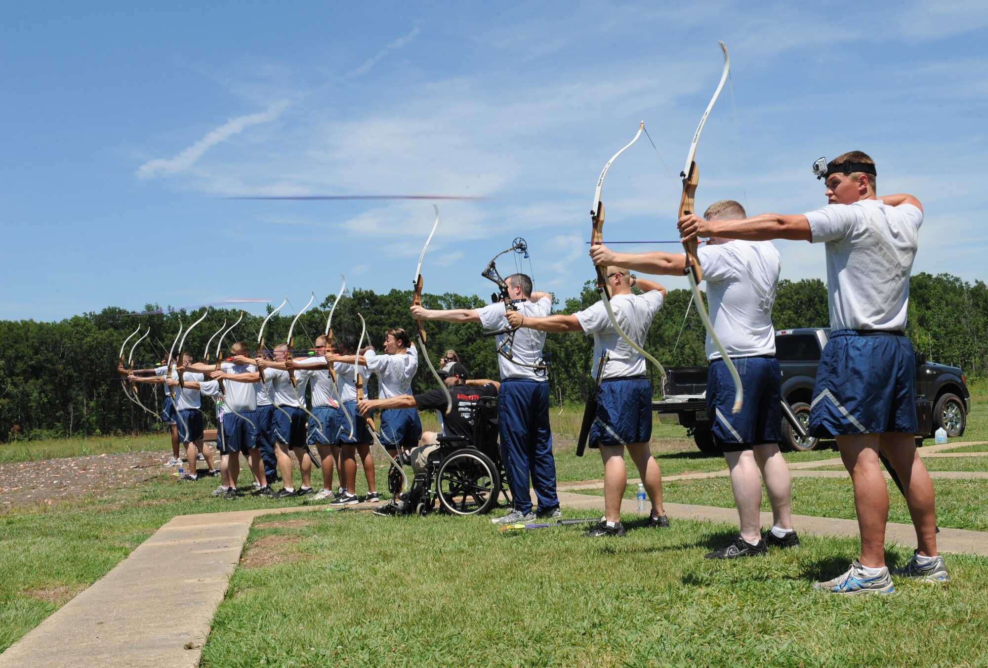 Barksdale Airmen and Mike Schultz, a MotoX dirt bike and SnoX snowmobile racer who lost his left leg after an accident, fire their arrows at archery targets on Barksdale Air Force Base, La., June 20. The archery event kicked off the Air Force Global Strike Command and American300 Warrior Tours "Do Something Amazing Outdoors" summer challenge. Airmen are encouraged to post their stories, photos and videos of their summer activities on the American300 facebook page. (U.S. Air Force photo/Airman 1st Class Benjamin Gonsier)(RELEASED)
