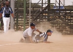 Texas Tigers catcher/coach Lupe Enriquez and Joint Base San Antonio-Lackland Warhawks third baseman Michael Charvat await the call at home plate during the Miken Chopper Challenge Softball Tournament Saturday. (U.S. Air Force photo/Robbin Cresswell)