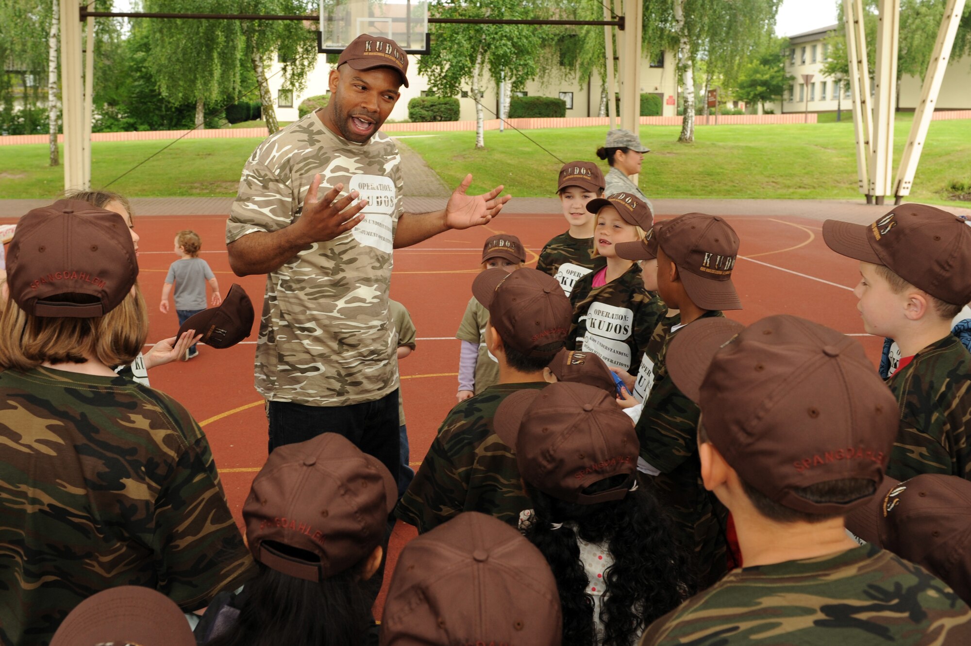 SPANGDAHLEM AIR BASE Germany-- Master Sgt. Mark Childs, 52nd Force Support Squadron, asks children if they are ready to have some fun during Children Deployment Day here June 21. The event was supported by a number of different organizations including the 52nd Medical Group, 52nd Logistic Readiness Squadron, 606th Air Control Squadron, airman and family readiness center and the 52nd Force Support Squadron, making Spangdahlem’s first ever Children Deployment Day complete. (U.S. Air Force photo by Senior Airman Christopher Toon/Released)